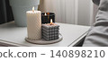 Decorative candles on a white table with a gray background 140898210