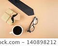 Desk with coffee, glasses, notebook, pen, and plant 140898212