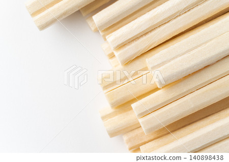Close-up of the tips of many disposable chopsticks Close-up of the tips of many disposable chopsticks 140898438