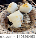 Mochi baked on a charcoal stove 140898463