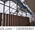 Apartment building undergoing major renovations. 140898465