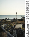 Fishing boat and float pulled ashore on the beach 140899154