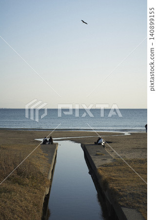 People gazing at the coastal waterway and the sea. People gazing at the coastal waterway and the sea. 140899155