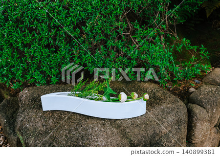 April 25 2026 Minimal Ikebana Flower Arrangement Displayed On Stone April 25 2026 Minimal Ikebana Flower Arrangement Displayed On Stone 140899381
