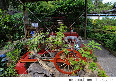 April 25 2026 Traditional Japanese Garden Display With Red Cart April 25 2026 Traditional Japanese Garden Display With Red Cart 140899408