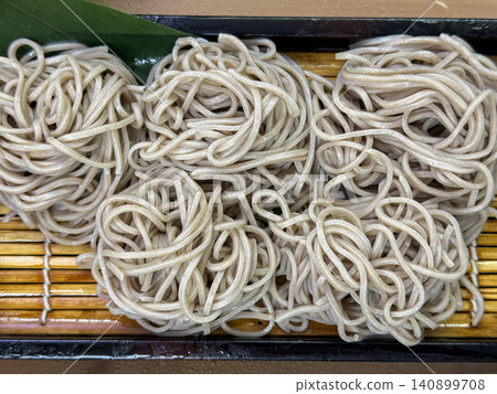 Handmade soba noodles served in a zaru soba (cold soba noodles) dish made with 50% buckwheat flour. Handmade soba noodles served in a zaru soba (cold soba noodles) dish made with 50% buckwheat flour. 140899708