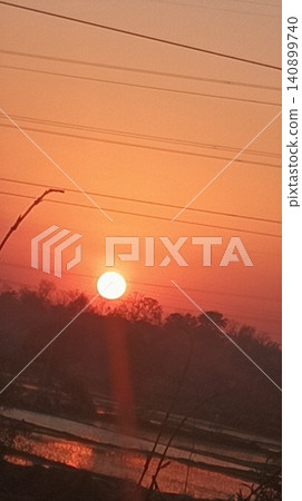 sunset at the mountain with silhouette of a tree sunset at the mountain with silhouette of a tree 140899740