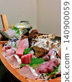 A boat-shaped platter of sashimi served at a traditional Japanese inn (Izu) 140900059