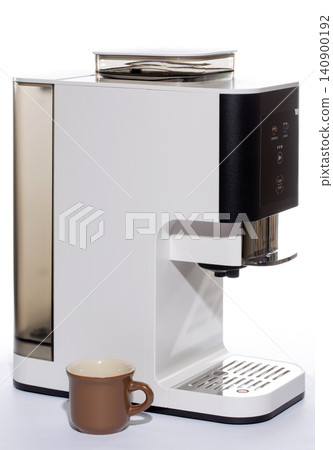 Automatic coffee machine with a cup on a white background Automatic coffee machine with a cup on a white background 140900192