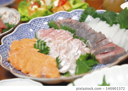 Appetizers, sashimi, and home-style hand-rolled sushi. Appetizers, sashimi, and home-style hand-rolled sushi. 140901372