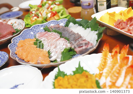 Appetizers, sashimi, and home-style hand-rolled sushi. Appetizers, sashimi, and home-style hand-rolled sushi. 140901373