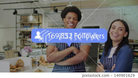 Standing bakery owners in striped aprons smiling and showing pastries at counter, 169,852 followers 140901629