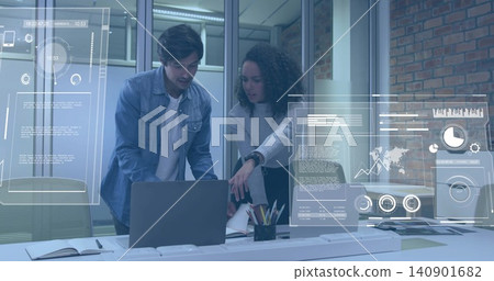 Pointing woman in light sweater leaning over laptop at office meeting area, with data overlays Pointing woman in light sweater leaning over laptop at office meeting area, with data overlays 140901682