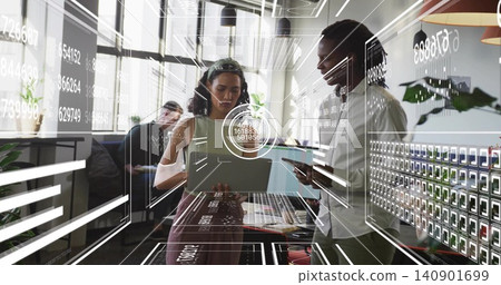 Collaborating business-casual team pointing at tablet and holding laptop in office with AR graphics Collaborating business-casual team pointing at tablet and holding laptop in office with AR graphics 140901699