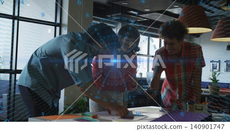 Leaning over table in office, colleagues in red top and shirts examining documents, AR overlay Leaning over table in office, colleagues in red top and shirts examining documents, AR overlay 140901747