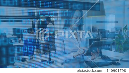 Tapping Korean woman wearing light blouse holding tablet in open office, binary overlay Tapping Korean woman wearing light blouse holding tablet in open office, binary overlay 140901798