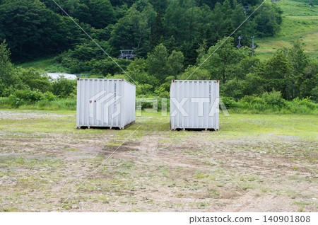 Two containers placed outdoors Two containers placed outdoors 140901808