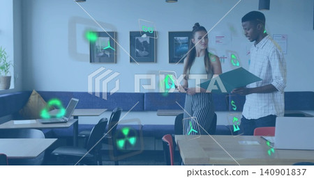 Reviewing two colleagues holding folder and tablet in cafe with laptops and holographic icons Reviewing two colleagues holding folder and tablet in cafe with laptops and holographic icons 140901837