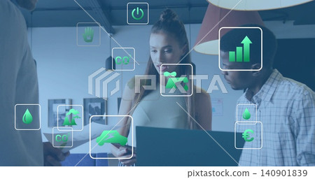 Presenting teen in sleeveless top showing smartphone and paper at office, with AR icons, laptop Presenting teen in sleeveless top showing smartphone and paper at office, with AR icons, laptop 140901839