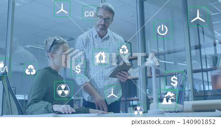 Pointing, man in checked shirt and woman in sweater reviewing drone at desk, with AR icons Pointing, man in checked shirt and woman in sweater reviewing drone at desk, with AR icons 140901852