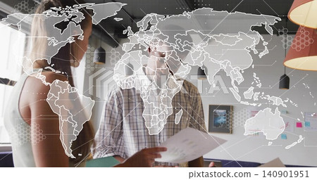 Reviewing team holding printed papers in office, plaid shirt and sleeveless top, world map overlay Reviewing team holding printed papers in office, plaid shirt and sleeveless top, world map overlay 140901951