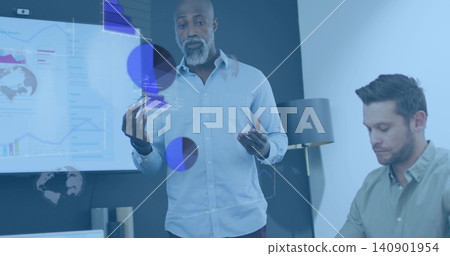Presenting mature man in light shirt gesturing and explaining on conference screen with AR overlays Presenting mature man in light shirt gesturing and explaining on conference screen with AR overlays 140901954