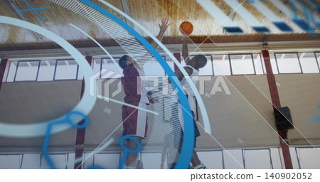 Jumping basketball players in jerseys reaching for ball at center court, referee tossing in uniform Jumping basketball players in jerseys reaching for ball at center court, referee tossing in uniform 140902052