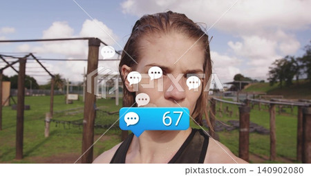 Standing woman in dark athletic tank sweating at outdoor fitness course, with chat bubbles, blue 67 Standing woman in dark athletic tank sweating at outdoor fitness course, with chat bubbles, blue 67 140902080