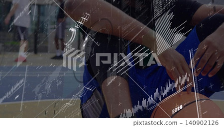 Dribbling player crouching handling ball on court in blue shorts knee sleeve ring data overlays 140902126