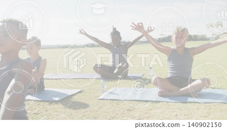 Stretching school-age boys in sleeveless tops and shorts on grassy field with mats, water bottles Stretching school-age boys in sleeveless tops and shorts on grassy field with mats, water bottles 140902150