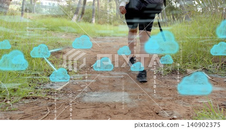 Walking woman in black shorts, trail shoes, carrying pack on dirt path, cloud icons, binary digits Walking woman in black shorts, trail shoes, carrying pack on dirt path, cloud icons, binary digits 140902375