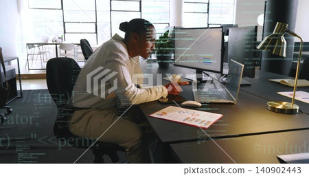 Working mature man in white long-sleeve shirt typing on laptop at open-plan office, with charts Working mature man in white long-sleeve shirt typing on laptop at open-plan office, with charts 140902443
