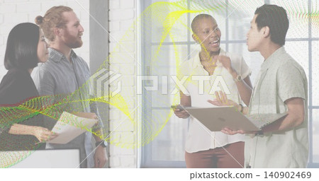 Talking team of four in office attire near window, brick column, with docs or laptop or phone or wav Talking team of four in office attire near window, brick column, with docs or laptop or phone or wav 140902469