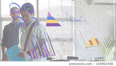 Walking three staff in shirts passing glass wall with projected charts in office holding folder Walking three staff in shirts passing glass wall with projected charts in office holding folder 140902480