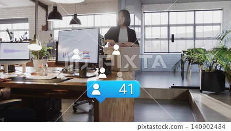 Sorting woman black-blazer white-top moving boxes at office with monitors and alert 41, copy space Sorting woman black-blazer white-top moving boxes at office with monitors and alert 41, copy space 140902484