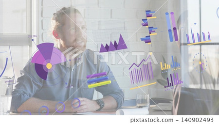 Presenting bearded man in button-up shirt explaining digital charts at meeting desk with monitor 140902493