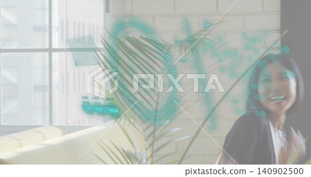 Turning woman wearing dark jacket, light top in lounge with teal holographic HUD, copy space Turning woman wearing dark jacket, light top in lounge with teal holographic HUD, copy space 140902500