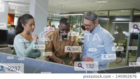 Reviewing work, three coworkers working around laptop at open office, in button-downs, AR overlays Reviewing work, three coworkers working around laptop at open office, in button-downs, AR overlays 140902676