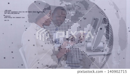 Working two coworkers in office attire reviewing code on monitor and tablet at desk, globe overlay 140902715