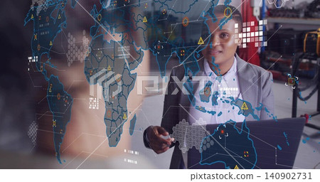 Gesturing African American woman in grey blazer holding laptop pointing at AR world map in lab Gesturing African American woman in grey blazer holding laptop pointing at AR world map in lab 140902731