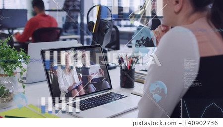 Working mature worker wearing black top, typing on laptop with virtual call at desk, copy space Working mature worker wearing black top, typing on laptop with virtual call at desk, copy space 140902736
