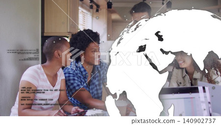 Discussing four colleagues leaning around table in coworking kitchen area, laptop and globe overlay Discussing four colleagues leaning around table in coworking kitchen area, laptop and globe overlay 140902737