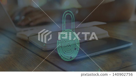 Projecting green padlock print hologram hovering over wooden desk, laptop, notebook, tablet nearby Projecting green padlock print hologram hovering over wooden desk, laptop, notebook, tablet nearby 140902756