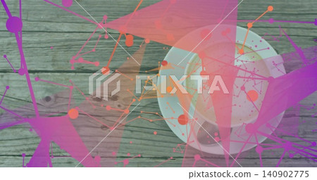 Showing white cup and saucer resting on worn table, metal spoon, frothy latte, pink-purple overlays Showing white cup and saucer resting on worn table, metal spoon, frothy latte, pink-purple overlays 140902775