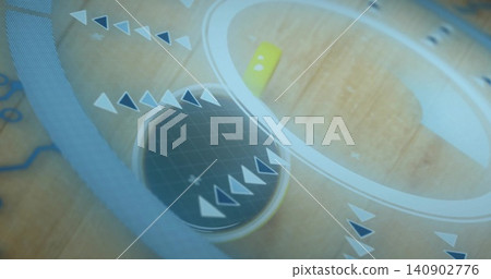 Displaying grid-disc with metal-rim spinning on wood-table, with arrows, pale-ring and yellow-pin Displaying grid-disc with metal-rim spinning on wood-table, with arrows, pale-ring and yellow-pin 140902776