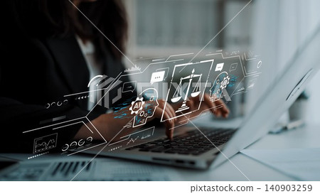 Business Professional Using Laptop with Digital Justice Symbols Representing Law Technology and Artificial Intelligence Concepts in Modern Office Setting. Entropy Business Professional Using Laptop with Digital Justice Symbols Representing Law Technology and Artificial Intelligence Concepts in Modern Office Setting. Entropy 140903259