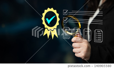 Close-up of a hand holding a magnifying glass examining a certification badge with checkmarks, representing quality assurance and inspection in a modern business environment. Glyphic Close-up of a hand holding a magnifying glass examining a certification badge with checkmarks, representing quality assurance and inspection in a modern business environment. Glyphic 140903380