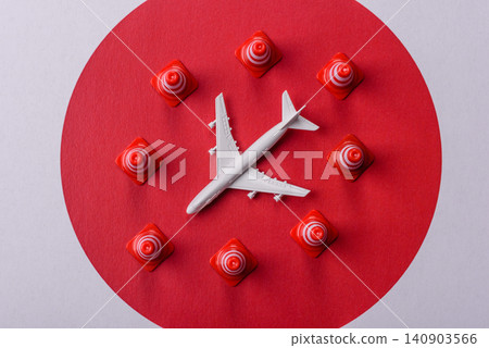 A mock up of airplane surrounded by no fly signs on a japanese flag A mock up of airplane surrounded by no fly signs on a japanese flag 140903566