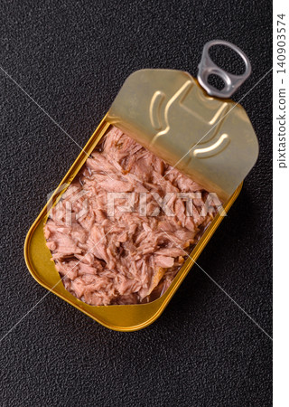 Fish, canned tuna chunks in brine for sandwiches and salads. Canned tuna 140903574