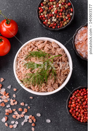 Fish, canned tuna chunks in brine for sandwiches and salads. Canned tuna 140903577
